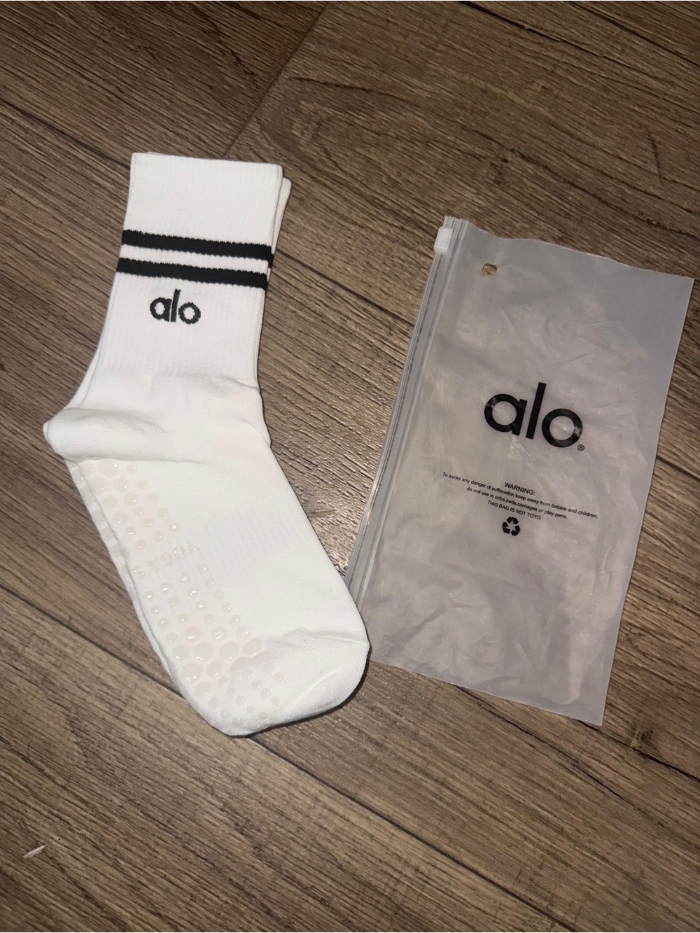 ALO Yoga White Crew Grip Socks with Black Stripe